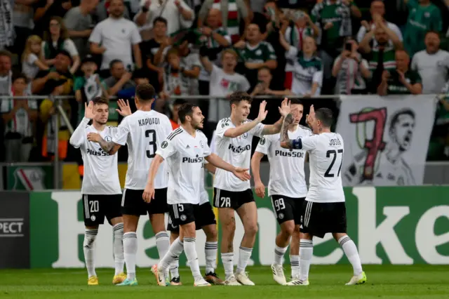 Ernest Muci celebrates with his Legia Warsaw team-mates