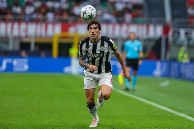 Newcastle's Sandro Tonali runs after a football while playing against AC Milan