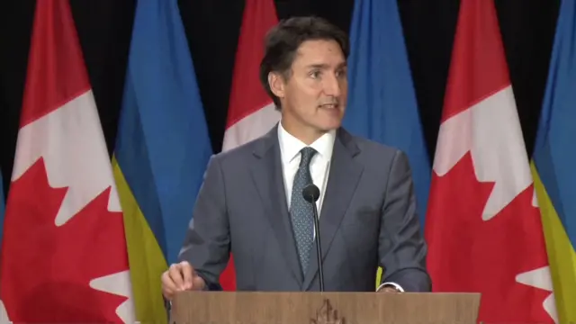 Trudeau speaks at a lectern