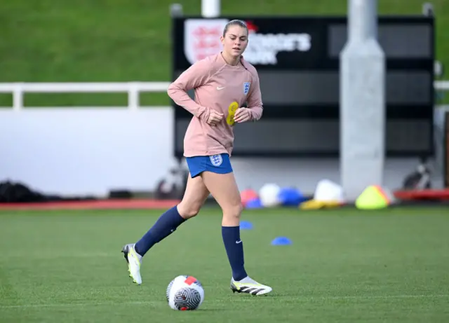 Alessia Russo runs to receive the ball during training.