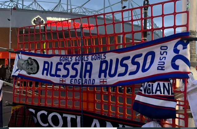 A scarf with the face of Alessia Russo on sale outside the ground.