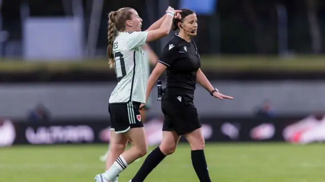 Carrie Jones signals for a change of referee