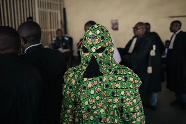 Masked witness leaving court in Goma, DR Congo