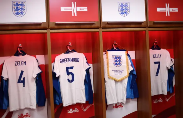 England players shirts hang ready in the dressing room.