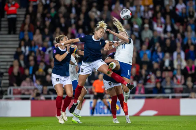 Lauren Hemp and Sophie Howard battle for the ball