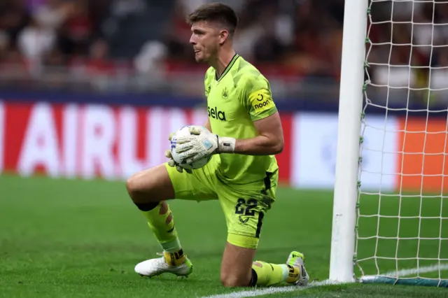 Nick Pope holds a football