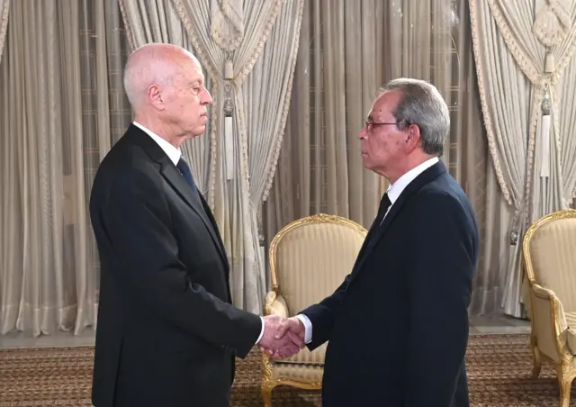 Ahmed Hachani (R) takes the oath of office at Carthage Palace, in Tunis, Tunisia on August 02, 2023.