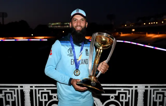 England's Moeen Ali celebrates winning the 2019 World Cup with the trophy at Lord's