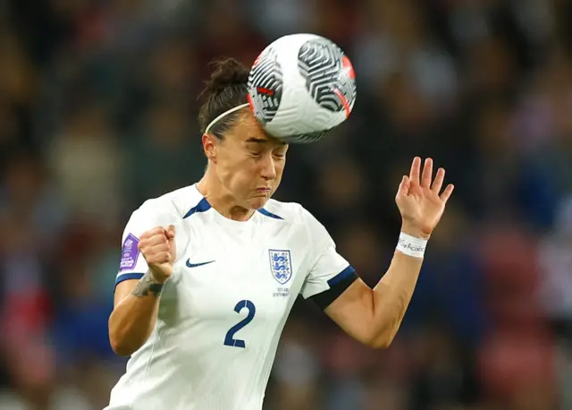 Lucy Bronze heading the ball