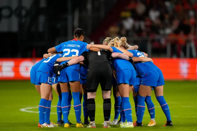 Iceland players in a pre-match huddle