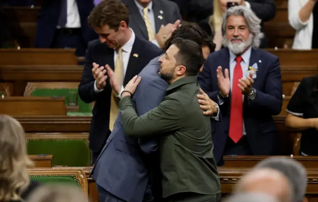 Zelensky and Trudeau hugging in parliament