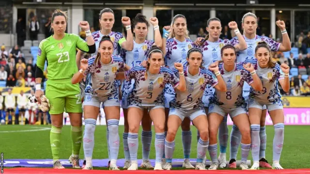 Spain players wear wristbands saying 'it's over'