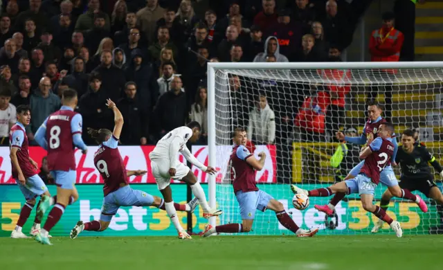 Rashford takes an attempt on goal while being charged down by Burnley defenders.