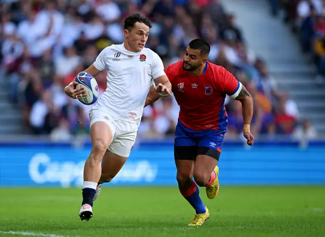 Henry Arundell of England runs with the ball