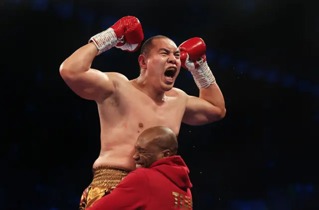 Zhilei Zhang celebrates beating Joe Joyce