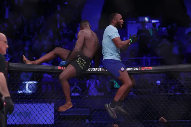 Fabian Edwards and Leon Edwards sit on the cage