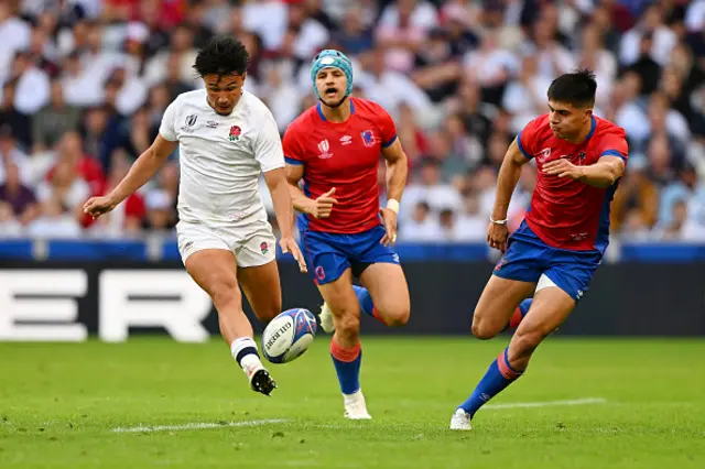 Marcus Smith of England kicks the ball ahead