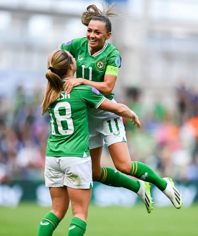 Katie McCabe celebrates Kyra Carusa's goal