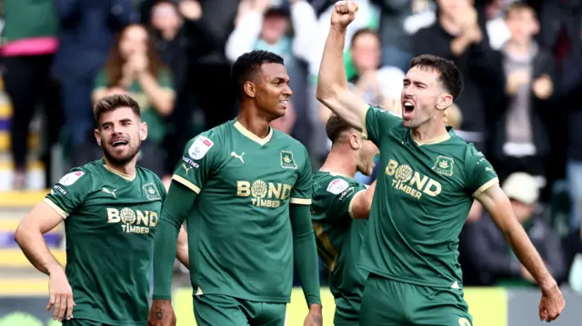 Morgan Whittaker celebrates scoring a hat-trick against Norwich