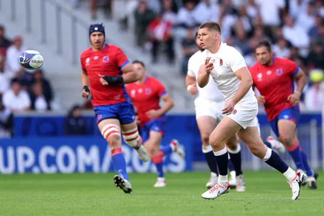 Owen Farrell of England passes the ball