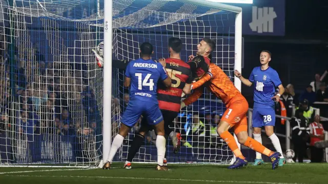 QPR midfielder Sam Field acrobatically clears the ball off his own goalline during their Championship game against Birmingham