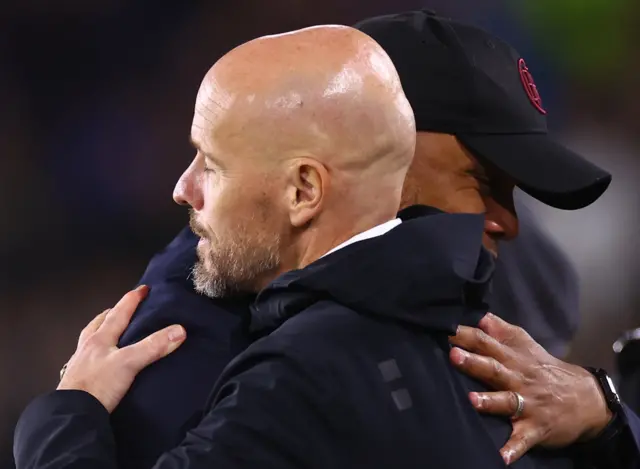 Ten Hag and Kompany embrace before kick off.