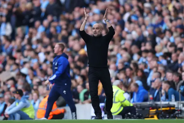 Pep Guardiola, Manager of Manchester City, reacts