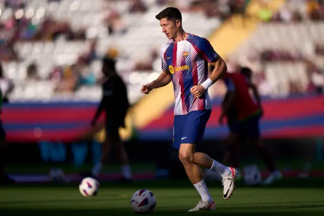 Barcelona's Robert Lewandowski warms up at Nou Camp