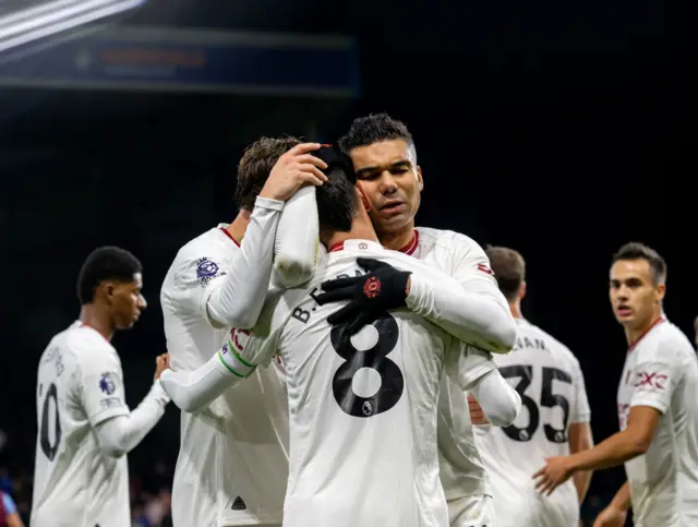 Casemiro and Fernandes embrace after the Portuguese' goal.