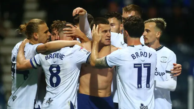 Milutin Osmajic (centre) celebrates a goal with his Preston team-mates