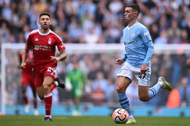 Phil Foden runs with the ball