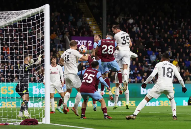 Evans rises highest to head the ball in from the corner.