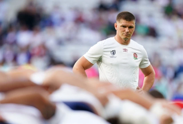 Owen Farrell looks on during the warm-up