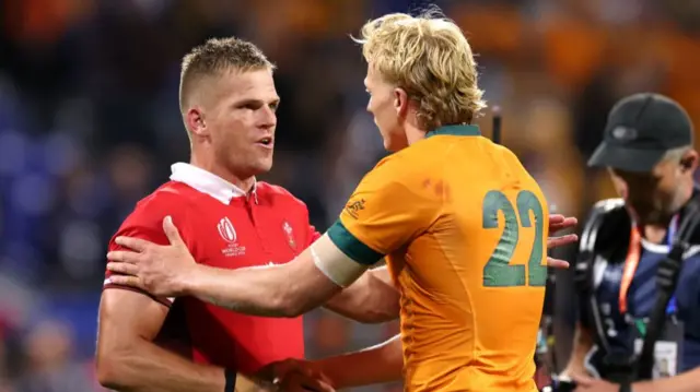 Gareth Anscombe shakes hands with Carter Gordon at full time