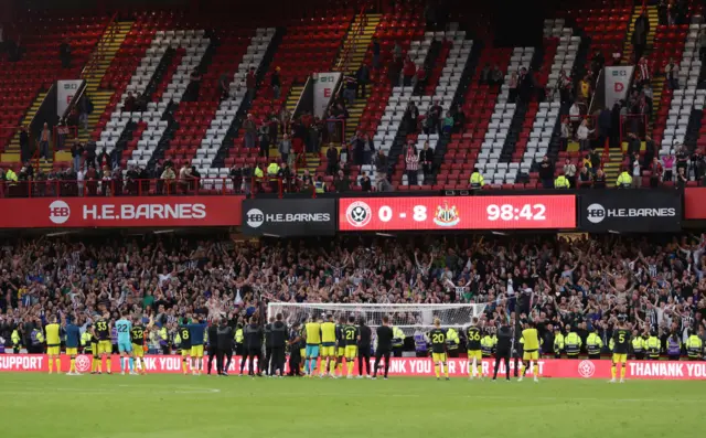 Newcastle United players celebrate with the fans