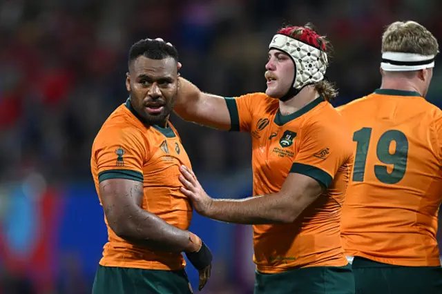 Fraser McReight of Australia consoles Samu Kerevi