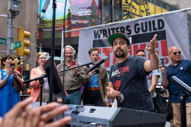 Lin-Manuel Miranda in the middle of a performance at a WGA protest in June