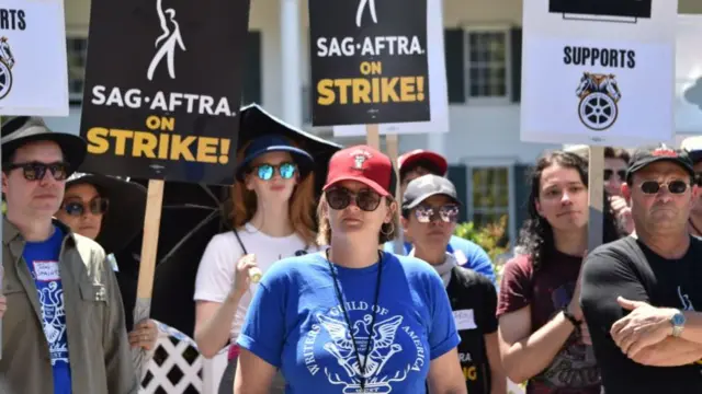 Chief negotiator for Writers Guild of America Ellen Stutzman looks on during a strike outside Amazon Studios