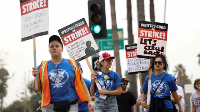 Writers walk the picket line outside Netflix offices in Los Angeles