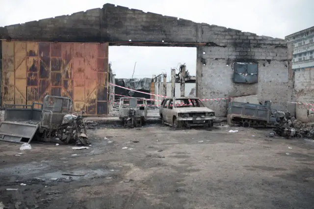 The burned out remains of a contraband fuel depot is pictured near the Benin-Nigeria border in Seme-Krake, on September 24, 2023.