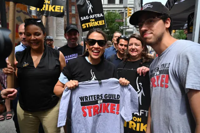 Congresswoman Alexandra Ocasio-Cortez at a joined writers and actors strike in July 2023