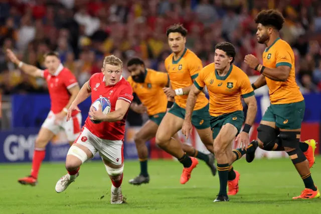 Jac Morgan breaks through the Australian defence before feeding Gareth Davies for Wales' opening try in the first three minutes.