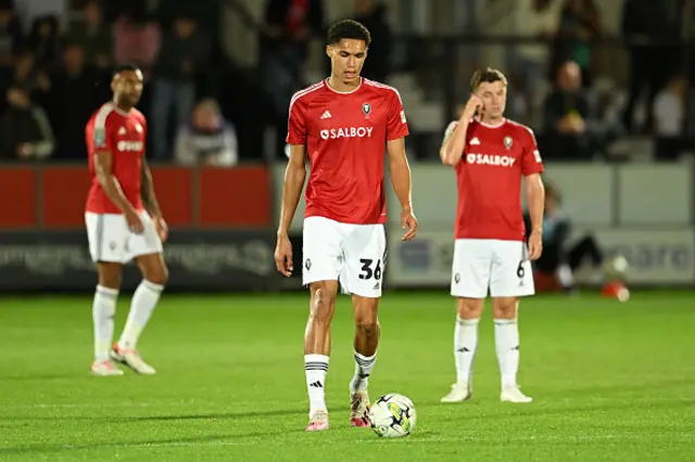 Marcus Dackers of Salford City looks dejected