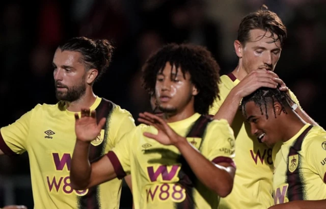 Burnley players celebrate after the final whistle