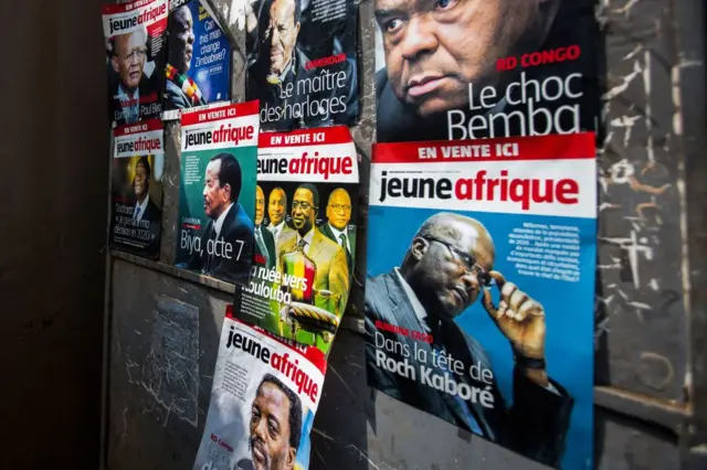 Posters advertising French newspaper 'Jeune Afrique' is plastered on a wall in downtown Kigali on August 2, 2018.