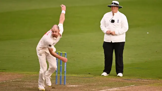 Sue Redfern standing as an umpire