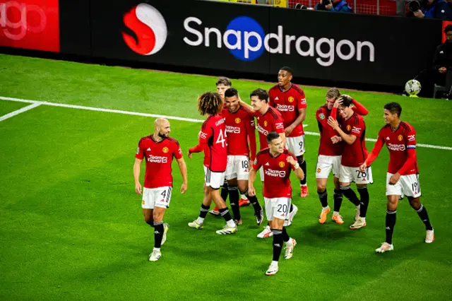 Manchester United players celebrate after scoring