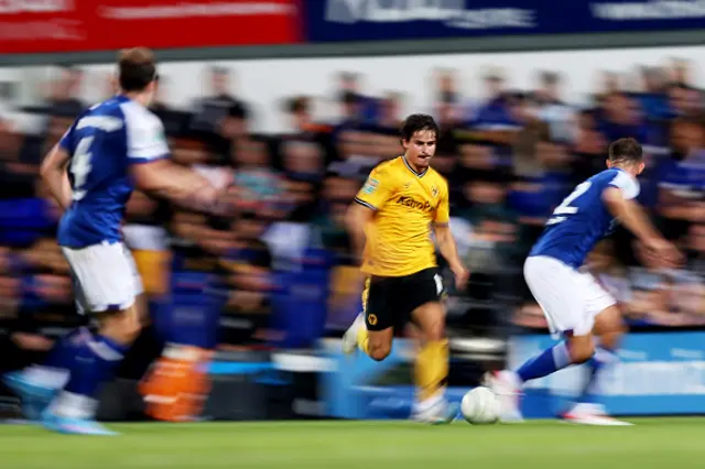 Hugo Bueno of Wolverhampton Wanderers runs with the ball