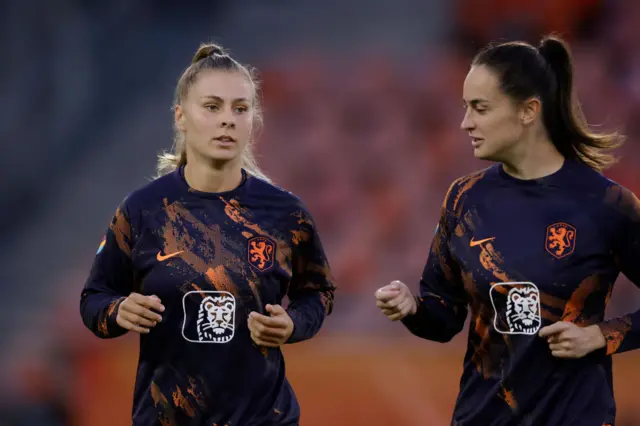 Pelova warms up alongside her Dutch teammate in Utrecht.