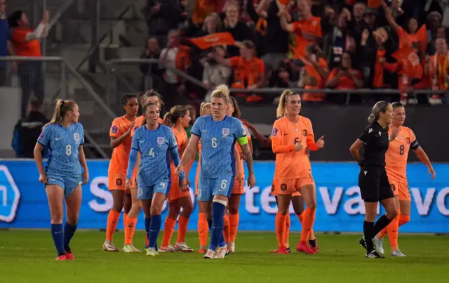 England players trudge to kick off as the Netherlands offside goal counts.